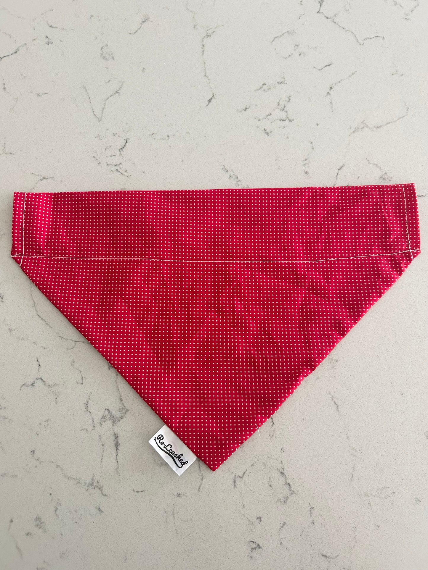 Red polka dot bandana on white background