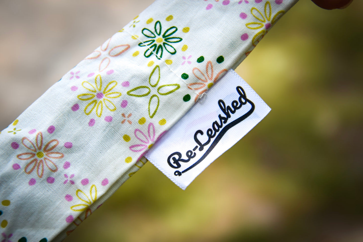 Close up of releashed tag on spring bloom leash cover