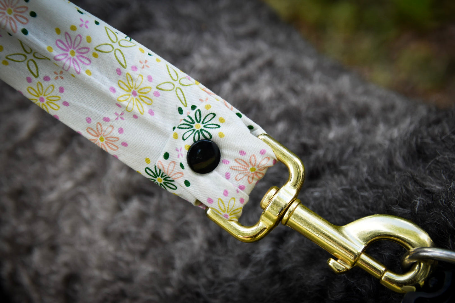Close up spring bloom leash cover clipped to collar