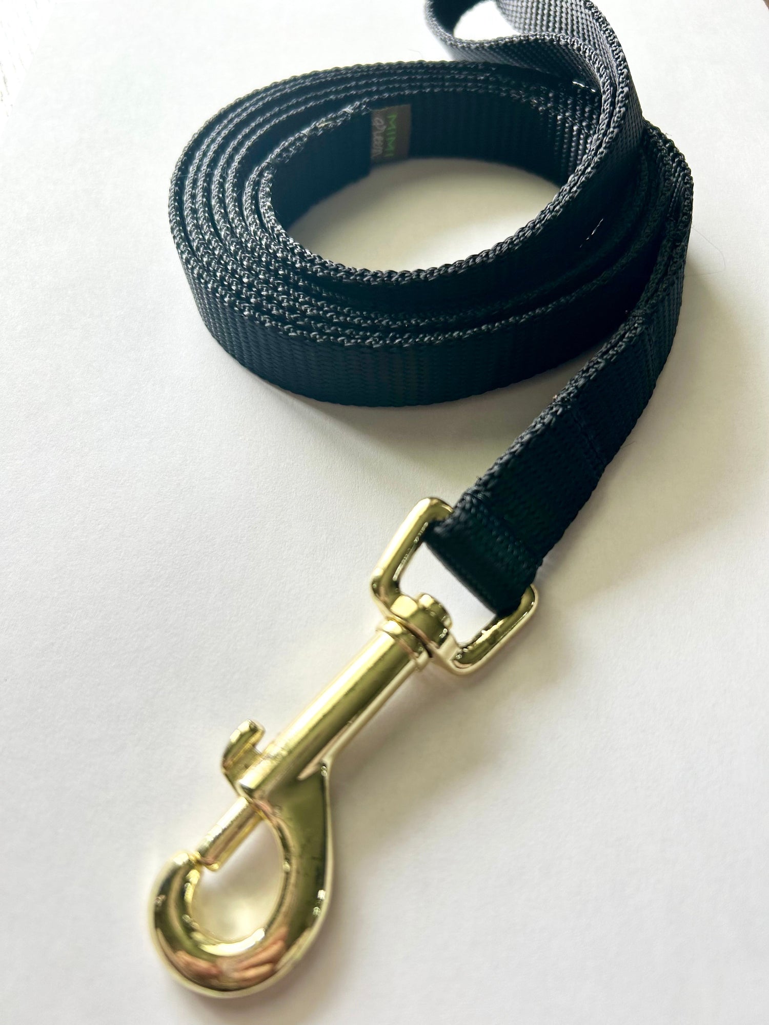 Black nylon leash on white background
