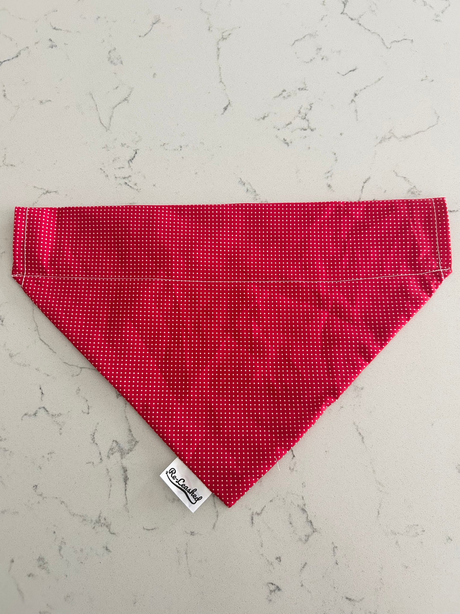 Red polka dot bandana on white background