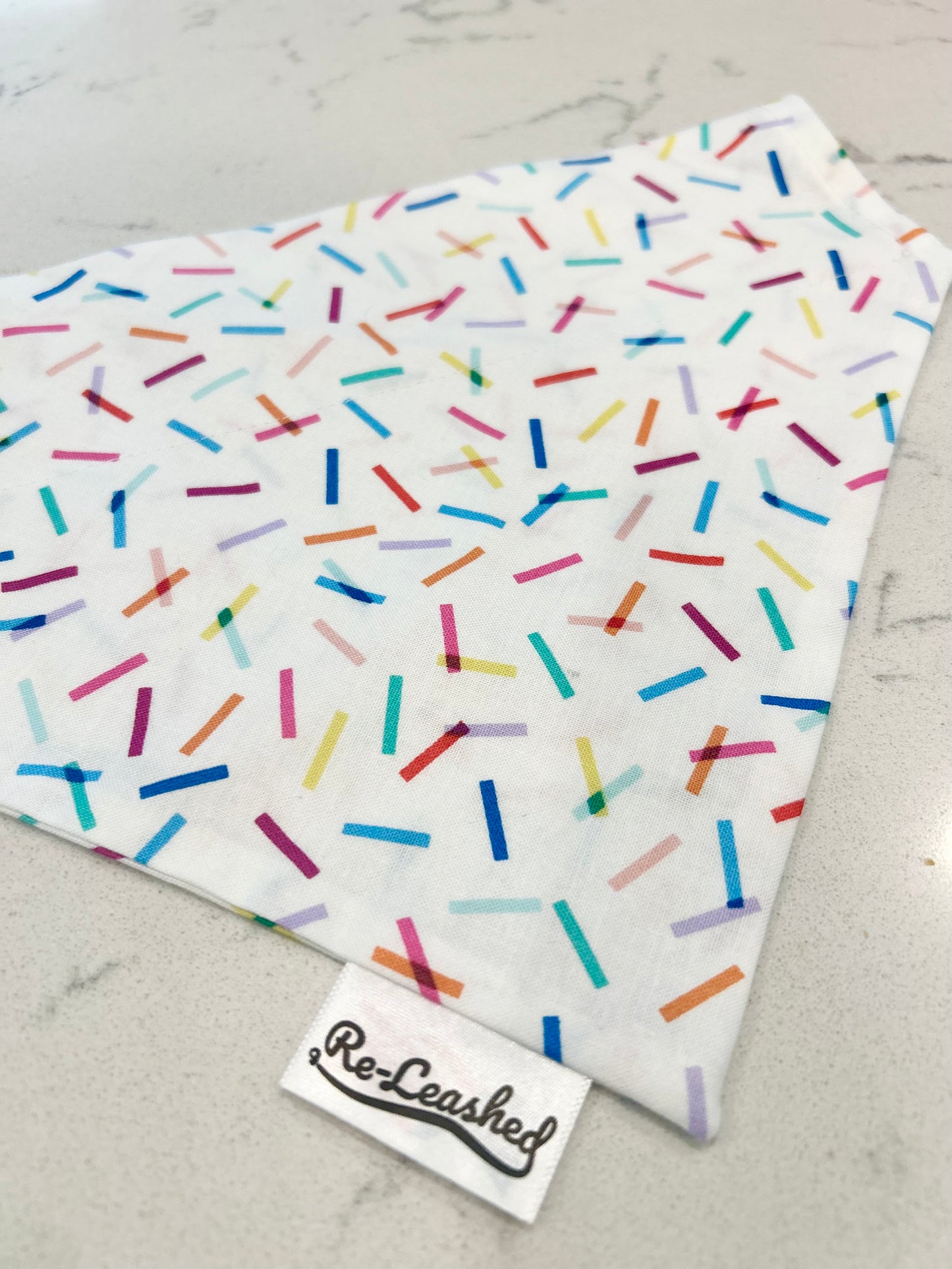 Confetti bandana on white surface