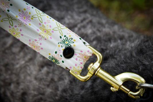 Close up spring bloom leash cover clipped to collar